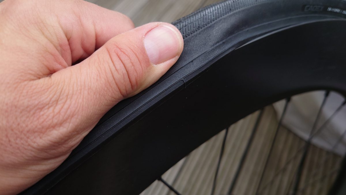 a person holding a tire