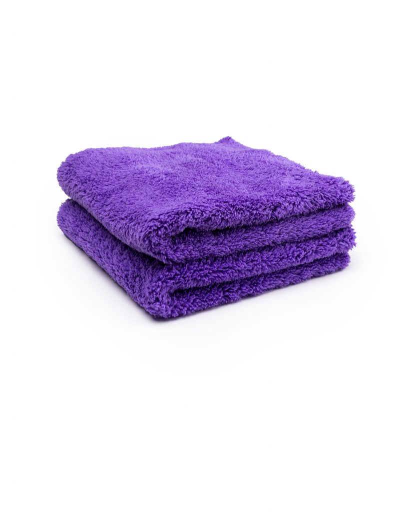 a stack of purple towels